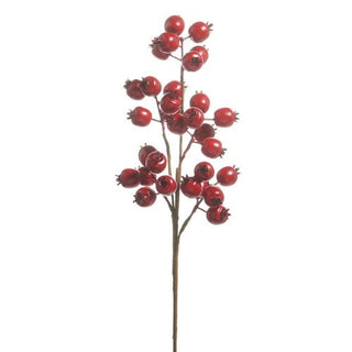 Artificial red berry branch on a white background