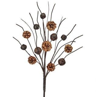 Decorative branch with pine cones and bells on a white background