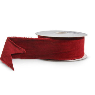Red ribbon on a white spool with a white background