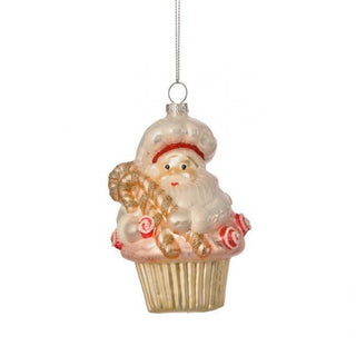 Decorative Christmas ornament shaped like a cupcake with a Santa Claus figure on a white background