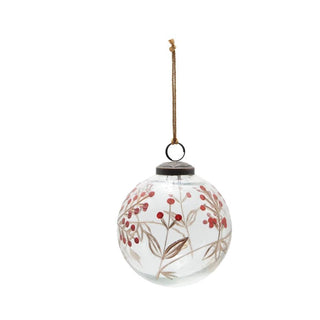 Decorative glass ball with floral design and hanging string on a white background