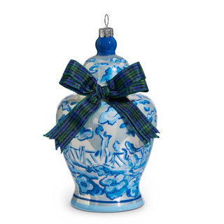 Decorative ornament resembling a blue and white ceramic vase with a green ribbon on a white background