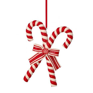 Decorative candy canes with a bow on a white background