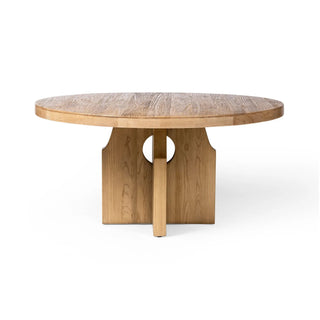 Side view of the Allandale Dining Table, showcasing its rounded top and sculptural cutout pedestal base.