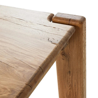 Detailed shot of the Marcia Dining Table's overstated joint, showcasing its craftsmanship.