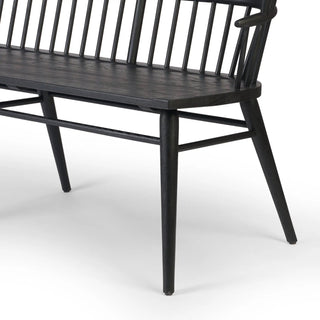 Angled side view of the Connor Bench, showcasing its finely sculpted frame and double-tiered backrest.