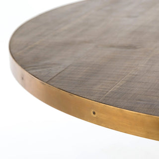 Close-up of the table edge, showing the brass steel band and smooth finish of the burnt oak top.