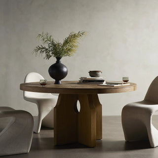 A modern dining space featuring the Allandale Dining Table in natural wood, styled with minimalist decor.