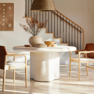 A stylish dining room setup with the Grano Dining Table, complemented by modern decor and neutral tones.