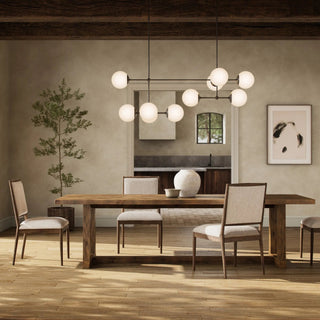 Stylish dining room featuring a rustic wooden dining table, modern lighting, and cozy seating.