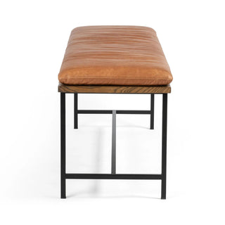 Full view of the Gabine Accent Bench, featuring brandy top-grain leather seating and black-finished iron legs.