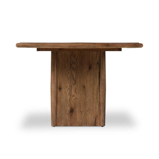 Straight-on front view of the Glenview Dining Table, showcasing its sturdy double pedestal base.