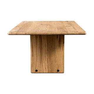 Straight-on front view of the Marcon Dining Table, highlighting its sleek pedestal panel legs.