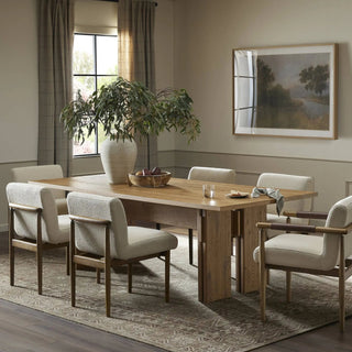 A beautifully styled dining room with the Railay Dining Table, complemented by neutral decor and cozy seating.