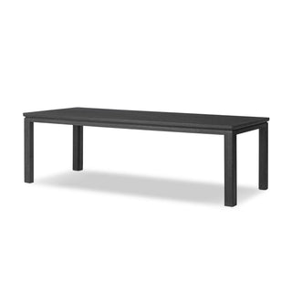 Full view of the Oman Dining Table, a modern black Parsons-style table with a rustic finish.