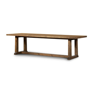 Full view of a rectangular rustic pine wood dining table with a trestle-style base.