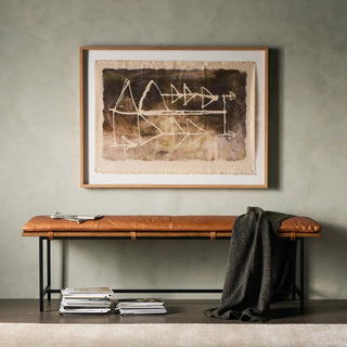 A modern entryway setup featuring the Gabine Accent Bench, styled with a framed artwork and neutral decor.