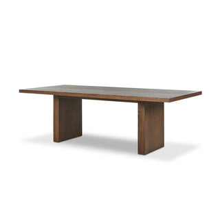 Full view of the Torrington Dining Table, a modern umber oak table with a waterfall-inspired leg design.