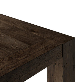 A detailed view of the smooth yet textured edge of the Abaso Dining Table’s thick-cut oak veneer.