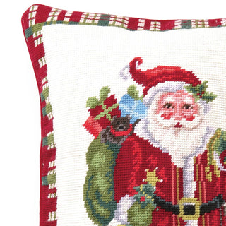 Cross-stitched design of Santa Claus holding holly leaves on a white background