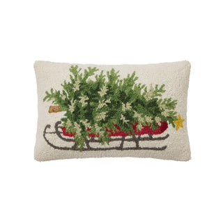 Decorative pillow with a Christmas tree on a sleigh design on a white background