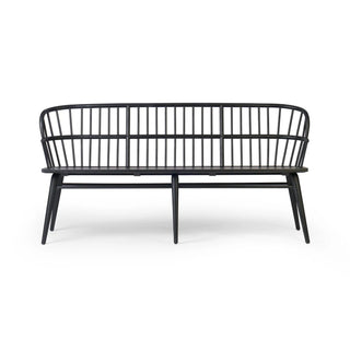 A side view of the Connor Bench, showcasing its sturdy frame and sculptural backrest.