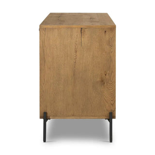 Side profile of an amber oak veneer sideboard, displaying the smooth oak finish and sturdy metal legs.