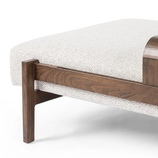 Detailed close-up of the soft white textured upholstery on the solid beechwood rectangle ottoman.