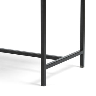 Close-up of the Gabine Accent Bench’s black-finished iron legs, highlighting its structural support.