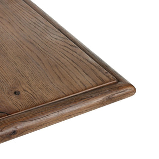 A close-up of the Glenview Dining Table’s corner, highlighting its refined craftsmanship and rounded edges.