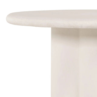 A side perspective of the Grano Dining Table, emphasizing its modern and sculptural aesthetic.