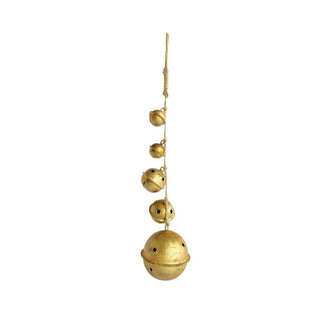 Gold bell hanging ornament on a white background