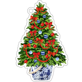 Decorative Christmas tree with red ribbons and blue ornaments on a white background