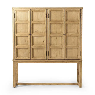 Front view of a worn oak cabinet with paneled doors and a sturdy base.