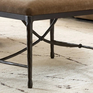  Close-up of the hand-forged iron legs of an art deco-style stool.