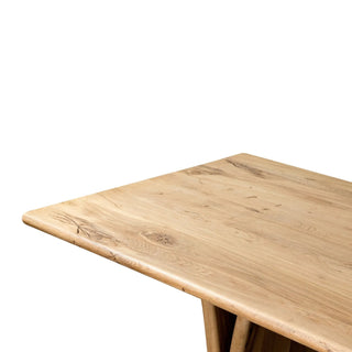 A close-up of the Marcon Dining Table’s natural reclaimed French oak finish, showcasing wood grain details.