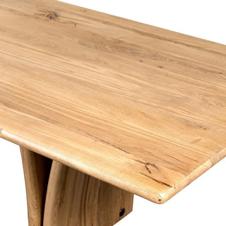 A detailed close-up of the Marcon Dining Table’s corner, highlighting the smooth reclaimed wood texture.