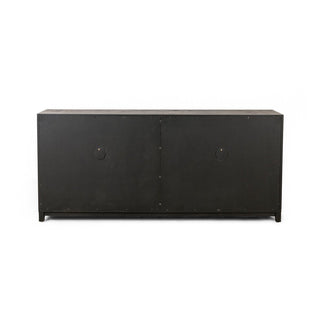 Rear panel of a black drifted oak sideboard featuring a solid wood backing with ventilation holes.