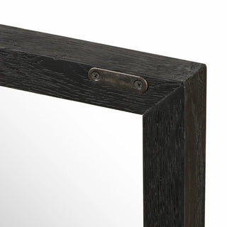 Frame detail of the black drifted oak sideboard featuring sturdy wooden joints and sleek metal accents.