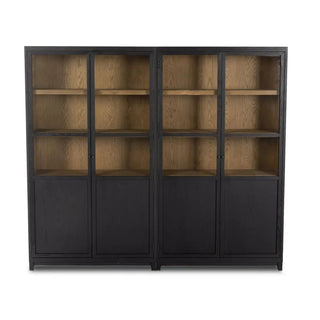 Front view of the wide oak cabinet with glass panel doors, black frame, and natural wood interior.