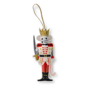 Decorative ornament shaped like a nutcracker with a gold crown on a white background