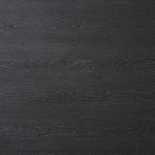 A detailed close-up of the Oman Dining Table's black wood grain texture, highlighting its rustic appeal.