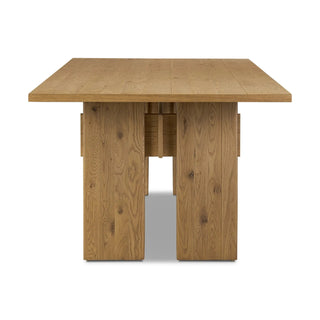 End view of the Railay Dining Table, displaying its wide pedestal legs and modern aesthetic.