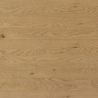 A detailed close-up of the Railay Dining Table’s light oak veneer, highlighting the natural wood grain.