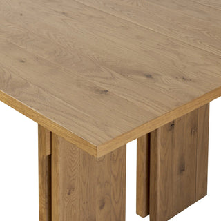 Angled view of the Railay Dining Table, showcasing its sleek lines and unique structural joints.