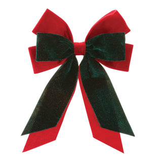 Red and green velvet bow on a white background