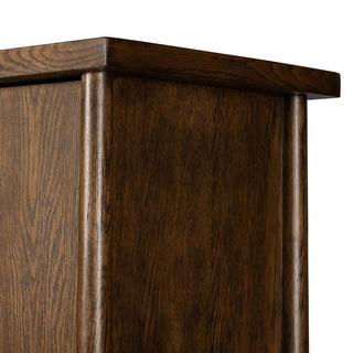 Essence view of a 3-door oak and veneer cabinet in a toasted finish, emphasizing its refined design and warm tones.