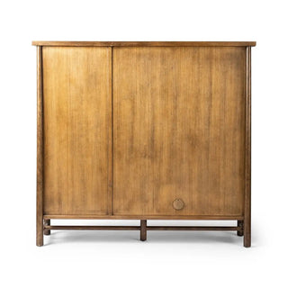 Back view of a 3-door oak and veneer cabinet in a toasted finish, displaying its well-constructed paneling.