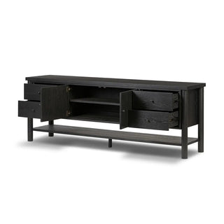 Black media console in ebony oak veneer with open storage compartments, revealing spacious shelving for media accessories.