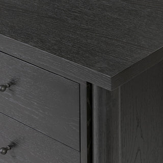 Close-up of the interior shelf of a black ebony oak media console, demonstrating its sturdy construction and functional design.